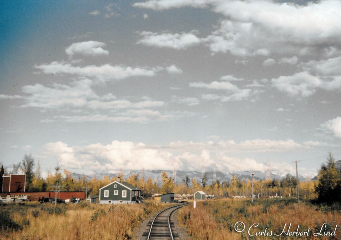 Section house at Eklutna looking Railroad North or real East. You can just make out the old CAA three tower antenna array on the hay flats. The square box structure to the left is an enclosed water tower. This is after 1948 because that is when they got the 52 foot box cars converted from Troop Cars. When basements went under section houses it was usually done at the expense of the family that was living there at the time. One of the benefits of being a Section Forman was housing but the ARR had no budget for improvements and no objection to a DIY project.