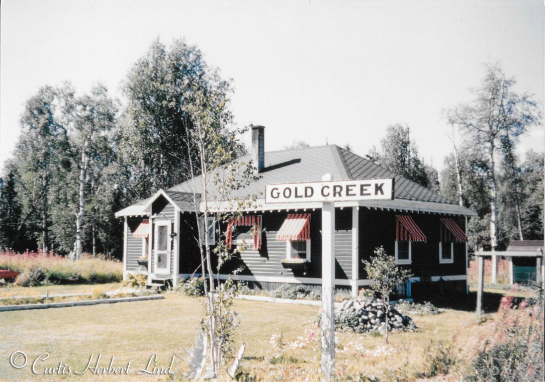 No idea who the resident Section Foreman was at Gold Creek but the family obviously took great pride in their section house accommodations. Good looking Park Service Green paint with white trim was the standard on the railroad from 1923 until modernization in 1948. The window screens, flower boxes and the candy stripe window awnings were not issued by the Alaska Railroad as there was no budget for such frills. This just demonstrates that your little acre of heaven is just a frame of mind and the ambition to enjoy life where ever you find yourself. From Gold Creek the only connection to the world was the railroad. 