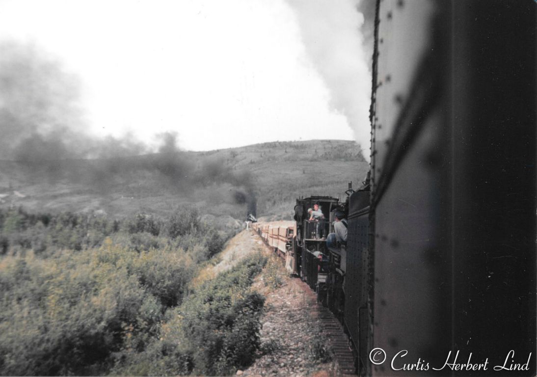 Another MOW movement with a Jordan Spreader and a steam locomotive on both ends of the movement. The string of equipment is a mystery as they just do not look like ballast cars. 