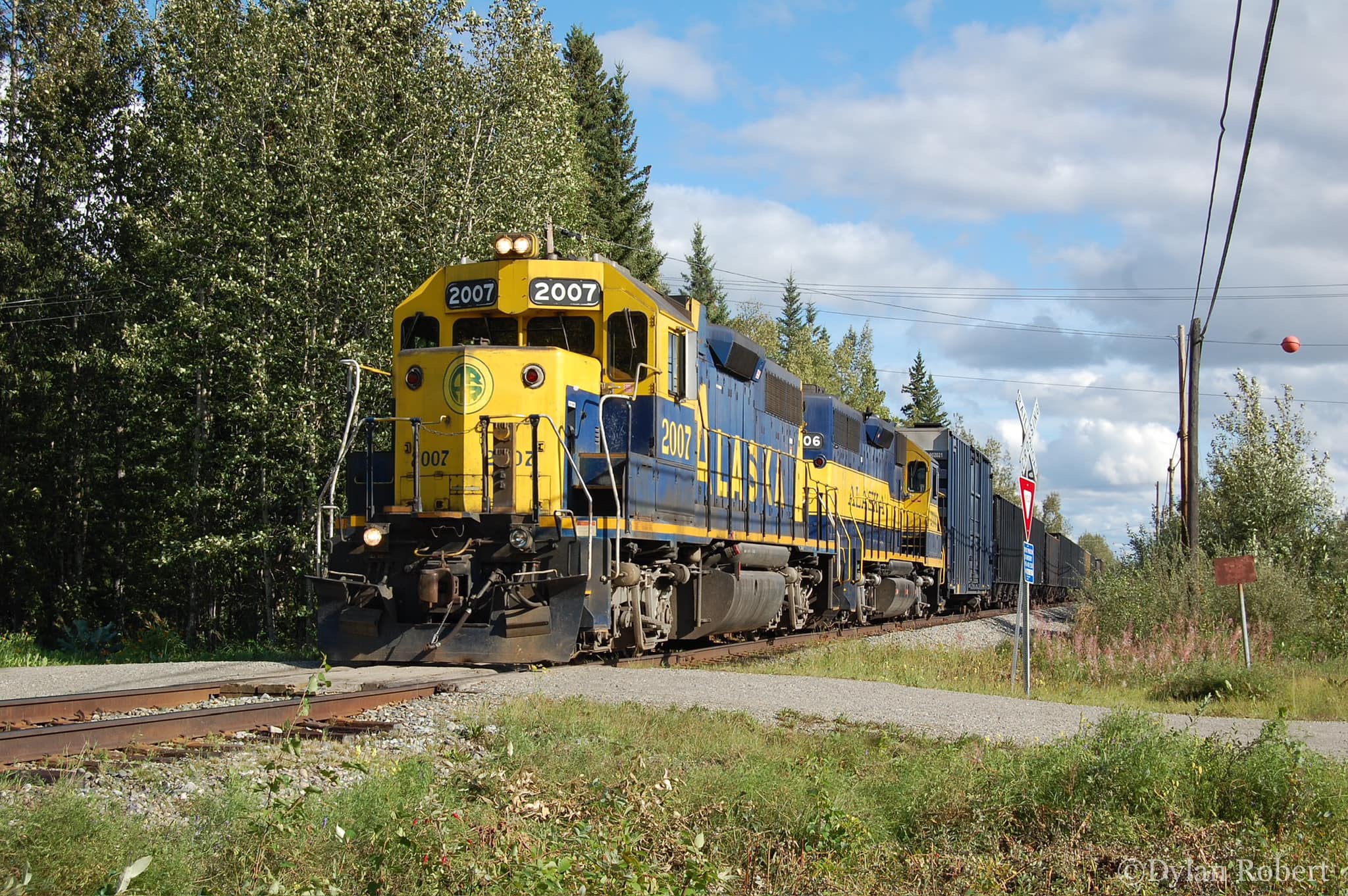 GP38-2’s 2007 and 2006 followed by the track geometry car and 17 empty coal hoppers from Eielson